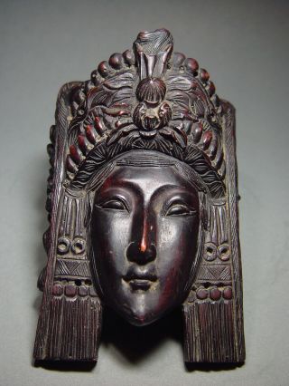 An Exotic Indonesian Goddess Wall Mask Relief Element.  19/20th C.