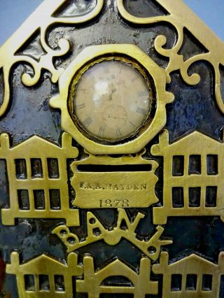 ANTIQUE VICTORIAN BRASS / IRON BANK MONEY BOX WITH CENTRAL CLOCK,  c 1878. 2