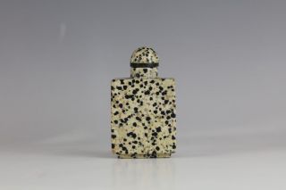 A Chinese Carved Dalmatian Jasper Snuff Bottle