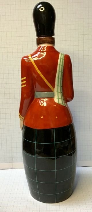 Vintage porcelain bottle shaped of Scottish soldier in kilt & marked Robj Paris 2