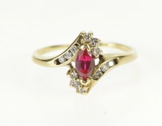 10k Marquise Syn.  Ruby Diamond Bypass Fashion Ring Size 5.  5 Yellow Gold 50
