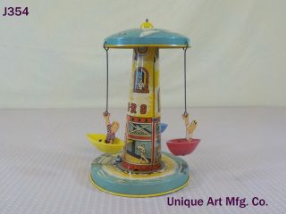 Vintage Antique Unique Art Mfg.  Company Tin Wind Up Toy Sail Away Carousel Rare