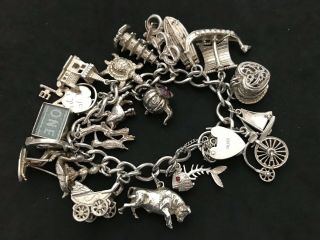 Vintage Sterling Silver Charm Bracelet with 21 Silver Charms.  82 grams 5