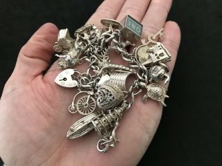 Vintage Sterling Silver Charm Bracelet with 21 Silver Charms.  82 grams 6