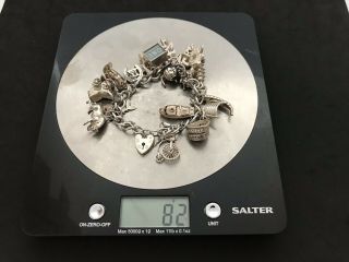 Vintage Sterling Silver Charm Bracelet with 21 Silver Charms.  82 grams 7