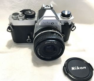 Vintage Nikon Fm 35mm Camera With 2.  8 Nikon Lens Series E