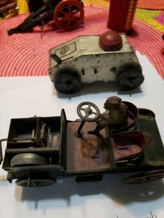 Two Tin Toy Car And A Toy Tank.  One Is A Louis Marx And The Other Says Drgm.