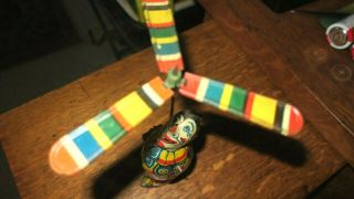 J CHEIN CIRCUS CLOWN VINTAGE 1930 ' s TIN WIND UP WITH SPINNING PADDLES.  EXC 2