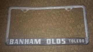 Banham Olds Oldsmobile Dealer Toledo Ohio Vintage License Plate Frame Cast Metal