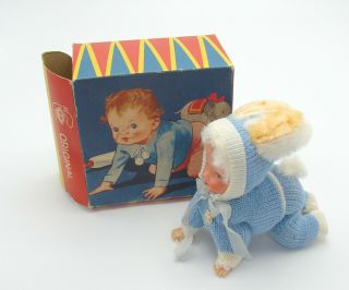 , West German Wind Up Celluloid Crawling Baby Blue Knit Bunny Ears