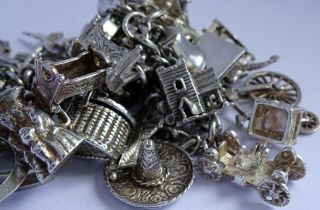 vintage heavy solid silver charm bracelet & 33 charms.  Rare,  open,  move 2