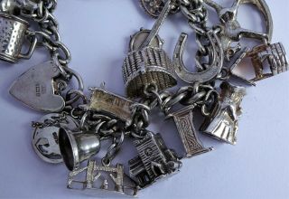 vintage heavy solid silver charm bracelet & 33 charms.  Rare,  open,  move 3