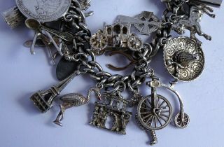 vintage heavy solid silver charm bracelet & 33 charms.  Rare,  open,  move 5