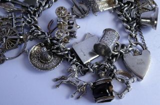 vintage heavy solid silver charm bracelet & 33 charms.  Rare,  open,  move 6