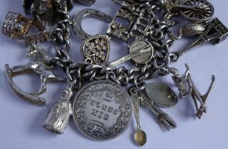 vintage heavy solid silver charm bracelet & 33 charms.  Rare,  open,  move 8