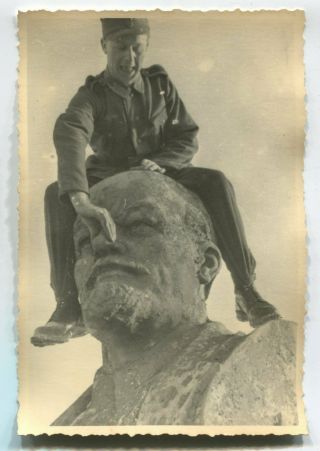 German Wwii Archive Photo: Wehrmacht Soldier Sitting On Top Of Lenin Monument