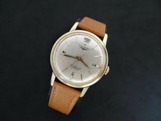 VINTAGE LONGINES CONQUEST GOLD & S.  STEEL DATE AT 12 AUTOMATIC CAL 291 10