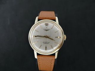 VINTAGE LONGINES CONQUEST GOLD & S.  STEEL DATE AT 12 AUTOMATIC CAL 291 11