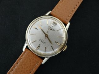 VINTAGE LONGINES CONQUEST GOLD & S.  STEEL DATE AT 12 AUTOMATIC CAL 291 2