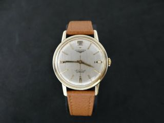 VINTAGE LONGINES CONQUEST GOLD & S.  STEEL DATE AT 12 AUTOMATIC CAL 291 4