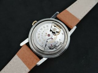 VINTAGE LONGINES CONQUEST GOLD & S.  STEEL DATE AT 12 AUTOMATIC CAL 291 9