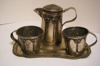 Antique Etched Tin Toy Tea Set