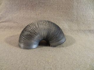 Vintage 1 1/2 " 1.  5 " Diameter Small Metal Slinky Toy