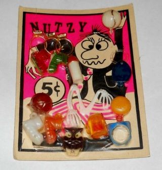 16 Vintage 1960`s Toy Plastic Nutzy Charms,  In Package
