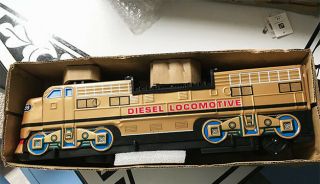 Vintage Tin Battery Operated Diesel Locomotive Gold With Lighted Moving Pistons