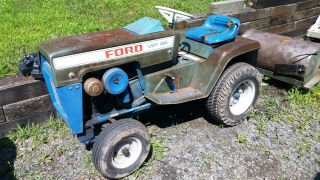 Vintage Ford Lgt 100 Lawn And Garden Tractor With 42 " Deck And 42 " Snow Blower
