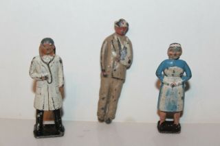 Three Vintage Lead Toy Figures Doctor,  Nurse,  Wounded Man Made In England