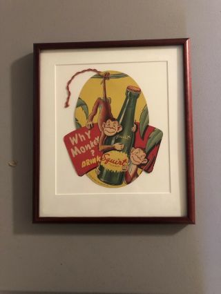 Framed Vintage Cardboard Squirt Monkey Advertisement