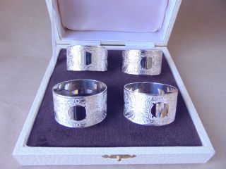 PRETTY SET OF 4 STERLING SILVER NAPKIN RINGS,  BOXED 2