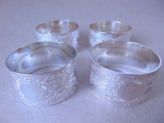 PRETTY SET OF 4 STERLING SILVER NAPKIN RINGS,  BOXED 5