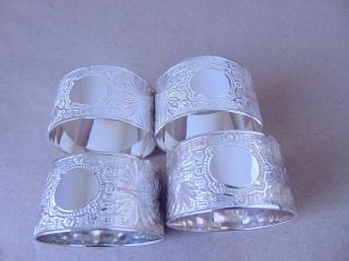 PRETTY SET OF 4 STERLING SILVER NAPKIN RINGS,  BOXED 7