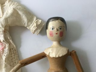 Antique Grodnertal jointed peg wooden doll dressed embroidered linen and lace 3