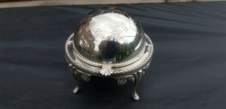 A Antique Silver Plated Roll Top Butter Dish With Engraved Patterns.