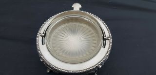 A antique Silver Plated roll top butter dish with engraved patterns. 7
