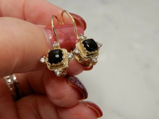 A 14 Ct Gold Onyx And Diamond Earrings