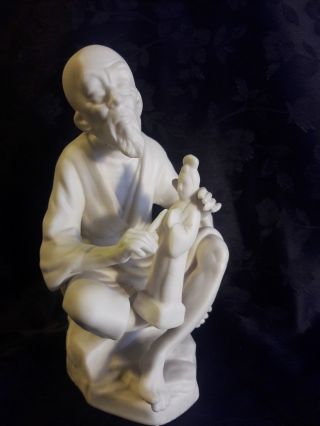 Bisque Porcelain Figure Of Chinese Man Carving A State Of Guan Yin