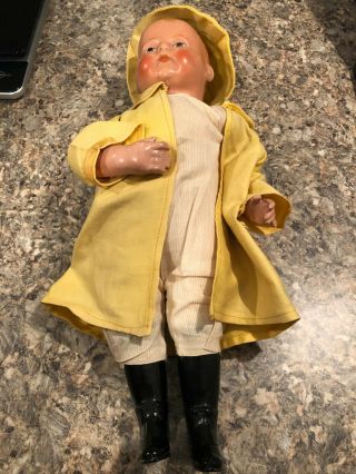 Antique Doll In Yellow Rain Suit