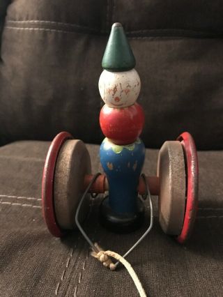 Vintage Metal And Wood Toy Rolling Clown Pull Toy With Bell Inside 7 " Tall