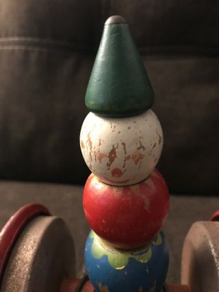 Vintage Metal and wood TOY ROLLING CLOWN Pull Toy with Bell inside 7 