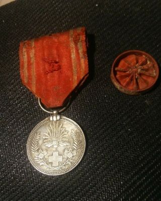 Wwi Japanese Manchukuo Red Cross Merit Silver Medal With Rosette