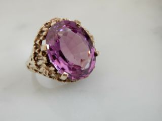 A Stunning 9 Ct Gold 12.  00 Carat Oval Amethyst Ring