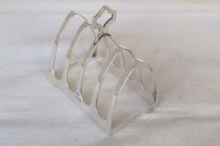 A SOLID STERLING SILVER FIVE BAR TOAST RACKS SHEFFIELD 1938. 7