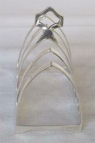 A SOLID STERLING SILVER FIVE BAR TOAST RACKS SHEFFIELD 1938. 8