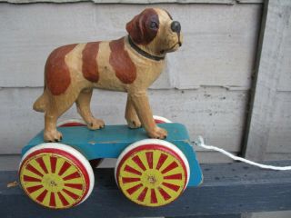 A Rare Antique Vintage Wooden Anri St.  Bernard Dog On Wheels Pullalong Circus Toy