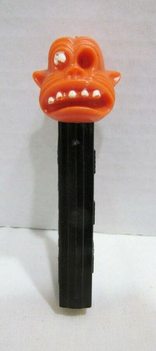 One Eyed Monster Pez Candy Dispenser Vintage No Feet Orange Head Black Stem