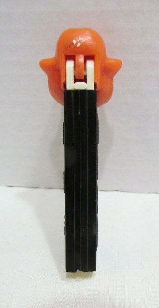 ONE EYED MONSTER PEZ CANDY DISPENSER VINTAGE NO FEET ORANGE HEAD BLACK STEM 4